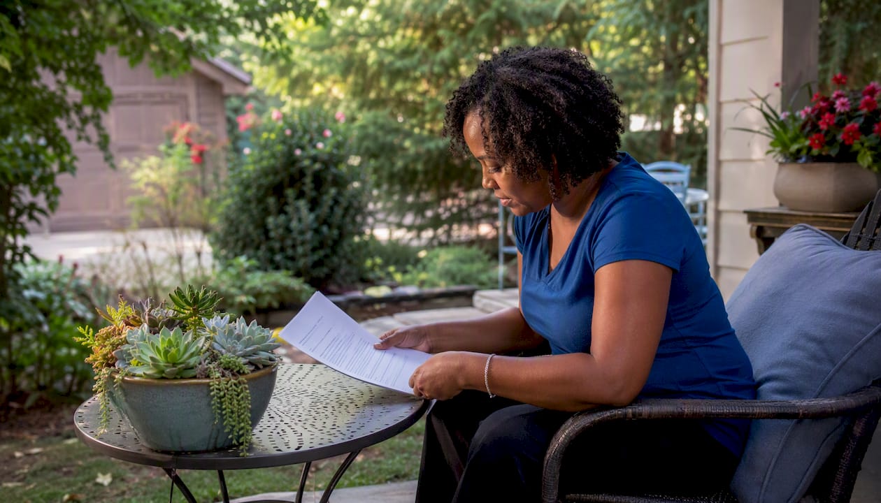 Hands reviewing commercial lawn care contract