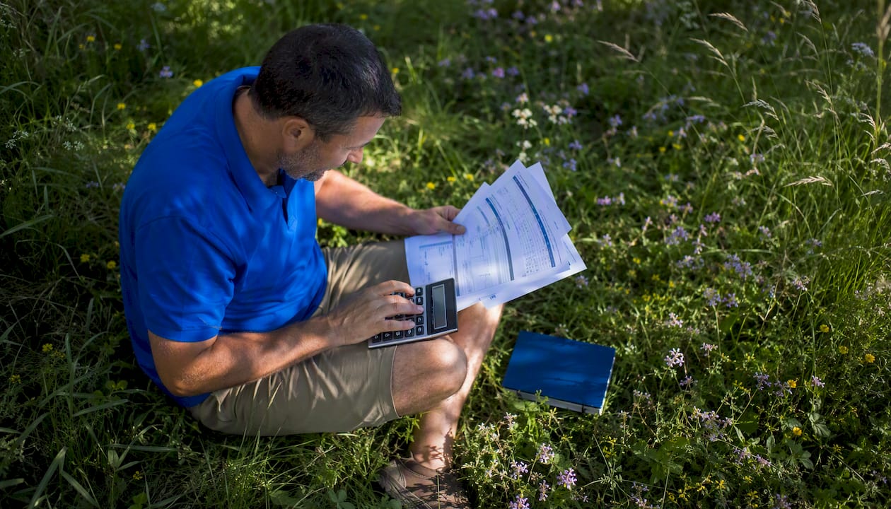 Facilities manager calculating energy savings