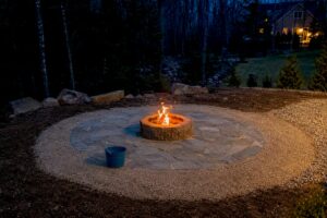 Stone fire pit in a cleared New Hampshire yard