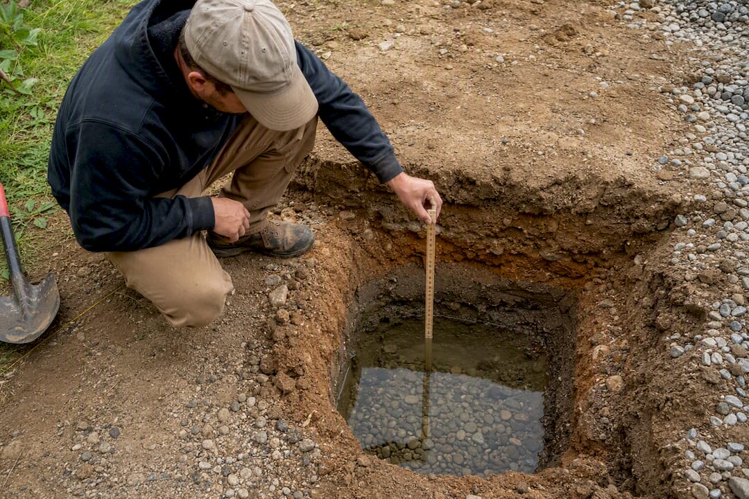 Percolation test hole beside driveway excavation