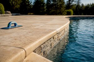 Travertine coping along a pool waterline