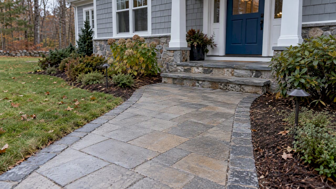 Finished New Hampshire front walkway beside home