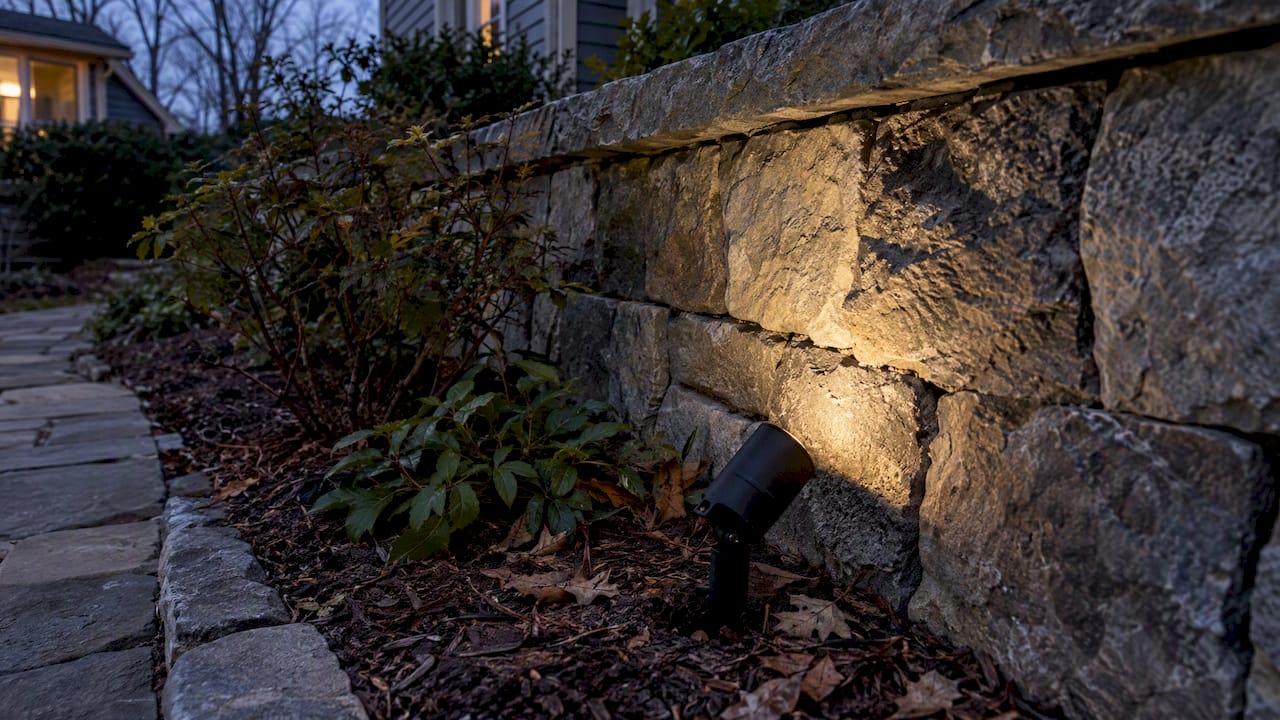Subtle grazing light reveals retaining wall texture