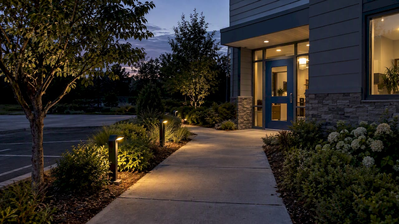 Commercial property walkway lit at dusk