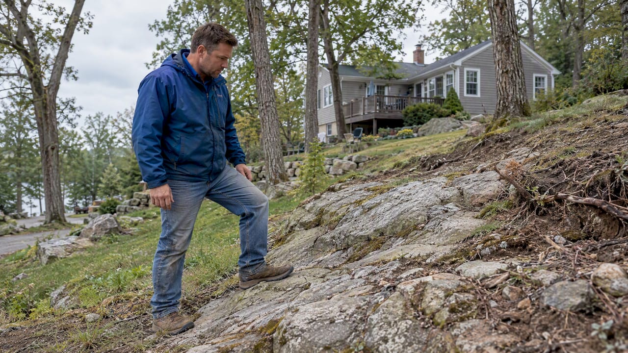 Contractor assesses exposed granite on New Hampshire lot